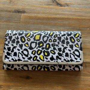 Leopard print wallet with snap closure, inside card holder‎ & zip coin pocket.
